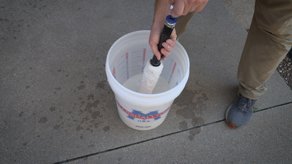 using the 2-in-1 roller cleaner to clean the cover